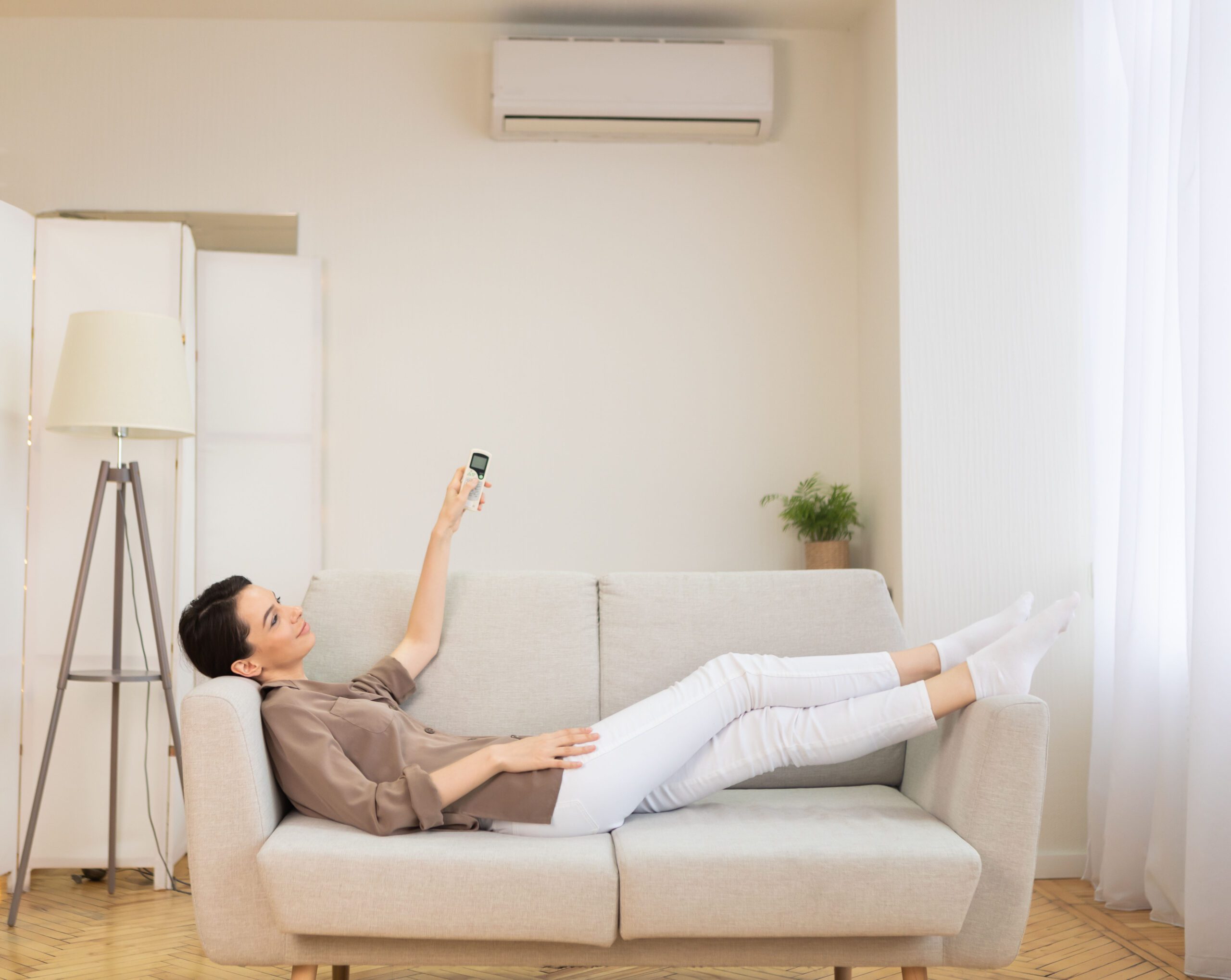 Woman enjoying Cool Comfort air conditioning